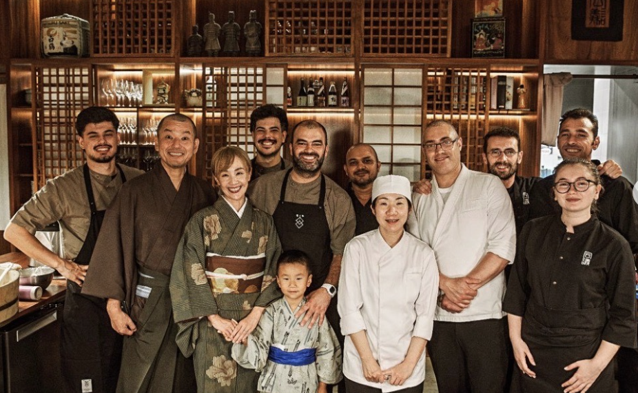 Collaboration team with Japanese chefs and Portuguese partners in traditional restaurant