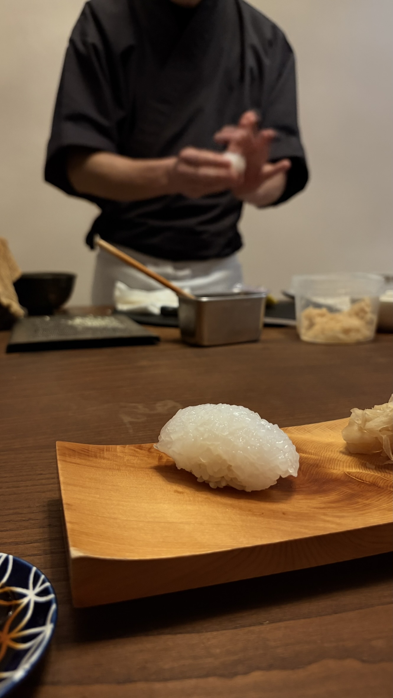 Traditional Japanese sushi preparation by a chef